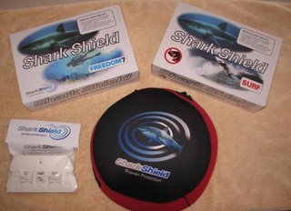 SharkShield: Clockwise from the left, Surf mounting plate, Freedom7 Shark Shield, Surf Shark Shield, Tote bag
