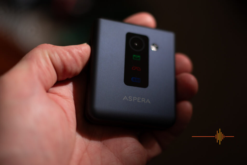 Aspera F50 mobile folding flip phone in a hand